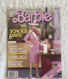 a magazine cover with a woman in a pink suit