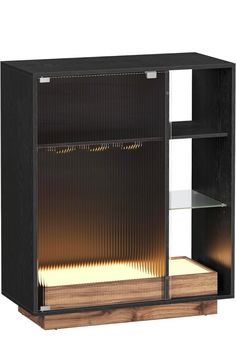 a black cabinet with an open shelf and light in the bottom section, on a white background