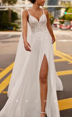 a woman in a white dress is walking down the street