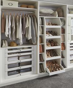 an organized closet with white drawers and shelves filled with shoes, clothing and other items