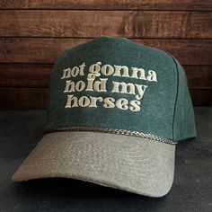 Vintage Style Not Gonna Hold My Horses Embroidered Faded Canvas Snapback Trucker Rope Hat with Free Shipping. White stitched text/logo. Condition is "New with tags". Shipped with USPS First Class. Step into the world of the great outdoors with our Not Gonna Hold My Horses Stitched Faded Canvas Rope Hat. With its faded canvas and rope accents, this hat exudes rustic charm and pays tribute to the iconic country music legends. Plus, enjoy free shipping on this vintage-inspired accessory that's perf Cotton Trucker Hat With Letter Print And Short Brim, Vintage Short Brim Hat With Letter Print, Vintage Adjustable Hat With Letter Embroidery, Horse Accessories, Text Logo, Music Legends, Hold Me, Western Outfits, Embroidered Design