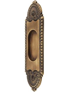 an ornate brass door handle on a white background