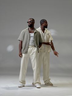 two black men standing next to each other