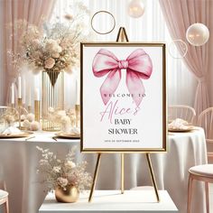 a welcome sign for a baby shower with pink bows