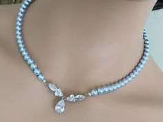 Wedding Light Blue Blush Blue Pearl Silver Choker Bridal Necklace. NECKLACE is about 18 inches (45.7cm) long. BACKDROP is about 4 inches (10.1cm). JEWELRY SETS SECTION: https://www.etsy.com/shop/LanaChayka?ref=seller-platform-mcnav§ion_id=18873488 BRIDAL JEWELRY SETS SECTION: https://www.etsy.com/shop/LanaChayka?ref=seller-platform-mcnav§ion_id=25839214 BRIDAL NECKLACES SECTION: https://www.etsy.com/shop/LanaChayka?ref=seller-platform-mcnav§ion_id=11638944 Elegant and classy, this stunning neckl Elegant Blue Wedding Necklace, Elegant Light Blue Necklaces For Gifts, Elegant Blue Wedding Necklaces, Light Blue Crystal Jewelry For Wedding, Elegant Light Blue Necklace For Wedding, Blue Pearl Necklace For Party, Blue Pearl Chain Necklaces For Wedding, Elegant Light Blue Pearl Jewelry, Elegant Light Blue Wedding Necklaces