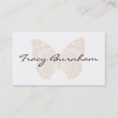 a white business card with a butterfly on it's back and the words, tray bum