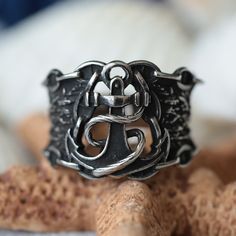 Introducing our Sailorman Anchor Ring, a rugged and timeless symbol of strength and adventure. Crafted from durable stainless steel, this vintage-inspired ring captures the allure of the high seas. Perfect for maritime enthusiasts and those who appreciate nautical fashion, this anchor ring makes a bold statement with its unique design and high-quality craftsmanship. Embrace the spirit of the open seas with our Sailorman Anchor Ring. --- Shipping info --- - Complimentary ring sizer is sent with e Anchor Ring, Anchor Rings, Nautical Jewelry, Jewelry Chain, Nautical Fashion, Unisex Ring, Vintage Ring, Chain Ring, Ring Vintage