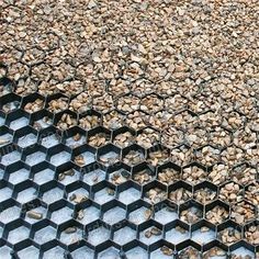 a close up view of some sort of hexagonal structure with rocks in it