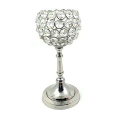 a silver candle holder with crystal balls on it