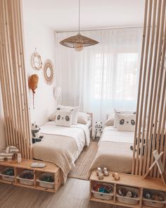 two beds in a room with wooden slats