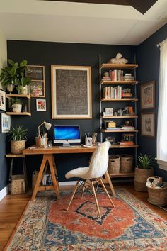 a desk with a computer on top of it in front of a book shelf filled with books