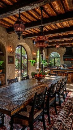 a large wooden table sitting in the middle of a kitchen