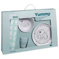 an elephant themed dinnerware set in a box