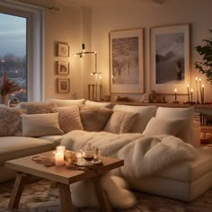 a living room filled with lots of furniture next to a large window covered in candles