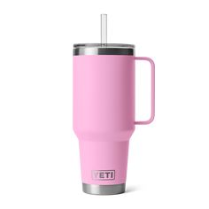 a pink yeti travel mug with a stainless steel lid and handle is shown on a white background