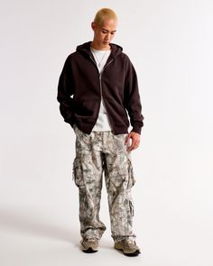 On-trend cargo pants in our comfortable rigid twill fabric and an ultra baggy fit through the leg, featuring side pockets, belt loops, interior drawcords and cargo-style pockets. Utility Pants Men, Camo Pants Men, Men's Bottoms, Utility Pants, Cargo Style, Camo Pants, Pocket Bag, Twill Fabric, Baggy Fits