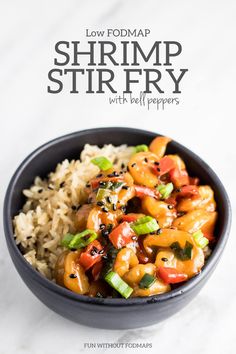 low fodmap shrimp stir fry with bell peppers in a bowl on top of rice