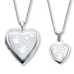 This mother and daughter necklace set features a heart-shaped locket and pendant decorated with hands and hearts. The set is crafted of sterling silver and comes with 14- and 18-inch box chains so mother and daughter have the perfect fit. Each necklace is secured with a spring ring clasp. Daughter Rings, Mother Daughter Necklaces, Mother Daughter Rings, Dolphin Jewelry, Mother Daughter Necklace, Peoples Jewellers, Daughter Necklace, Silver Lockets, Silver Engagement Rings