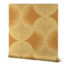 an orange and gold wallpaper with palm leaves on the front, against a white background