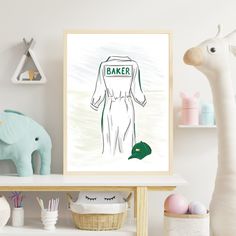 a white table topped with an art print of a baseball uniform and a green hat