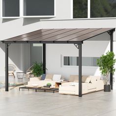 an outdoor living area with couches and tables