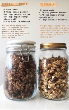 two jars filled with granola sitting on top of a table