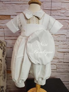 "Free Shipping!! Baby Boy Christening Outfit, Blessing or Baptism Outfit, Boy Baptism Outfit, Four Pieces, Traje Modelo Español de 4 piezas  Color:  -Ivory Comes with: -Shirt -Jumper -Bow Tie -Beret Measurements are in inches: Size 6-9 months, Jumper (waist 16\", long 19\", Shoulder to shoulder 8.5\") Size 9-12 months, Jumper (waist 17\", long 21\", Shoulder to shoulder 9\") Size 12-18 months, Jumper (waist 19\", long 23.5\", Shoulder to shoulder 9\") Size 18-24 months, Jumper (waist 21\", long 25\") Shirt (Shoulder to shoulder 10.5\") 💗 BEAUTIFUL DESIGN This Boy Christening Outfit stands out for its elegant craftsmanship. 💎 HIGH-QUALITY The Outfit are made of very good quality materials. 🎁 IDEAL GIFT If you are looking for a Boy Christening Outfit for a celebration such as Christening, Fitted Beige Baptism Dress, Fitted Beige Sets For Baptism, Elegant Beige Sets For Baptism, Elegant Beige Baptism Set, Classic Cream Baptism Clothing Set, Classic Cream Sets For Baptism, Elegant Cream Sets For First Communion, Elegant Cream First Communion Sets, Elegant Gold Baptism Dress