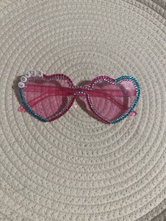 pink heart plastic glasses with letter beads& flat back glass crystals. Embellished by hand individually.  Adult size. Not intended for children. Not actual sunglasses, more of fashion glasses. Rhinestone Heart Glasses, Diy Heart Glasses, Decorated Heart Glasses, Bedazzled Heart Sunglasses, Personalized Pink Sunglasses For Party, Playful Pink Heart-shaped Sunglasses, Pink Plastic Sunglasses For Birthday, Pink Heart-shaped Party Sunglasses, Pink Fun Sunglasses With Glass Lenses