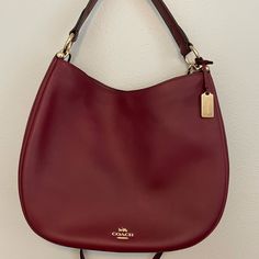 Nwot Wine Color Coach Purse With Gold Hardware. It Can Be Worn As A Crossbody Or Shoulder Purse. Has Plenty Of Room And Little “Compartments” To Keep Things Nice And Organized. Formal Coach Hobo Bag, Elegant Coach Hobo Bag For Formal Occasions, Elegant Burgundy Hobo Bag With Removable Pouch, Elegant Burgundy Tote Hobo Bag, Elegant Burgundy Hobo Bag For Shopping, Elegant Coach Hobo Bag With Detachable Handle, Elegant Burgundy Bag For Errands, Bags Coach, Wine Color