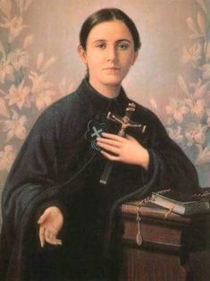 a painting of a woman with a cross in her hand and a book on the table