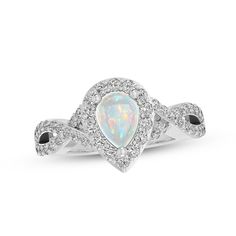 An iridescent pear-shaped lab-created opal is the striking focal point of this enchanting ring. Sparkling white lab-created sapphires surround the center and twist down the split-shank band, which is crafted in sterling silver. The lovely ring makes the perfect gift for a loved one with an October birthday. White Lab, October Birthday, Opal White, Silver Prices, Lovely Ring, Sapphire Stone, Opal Jewelry, Ring Sterling Silver, Sterling Ring