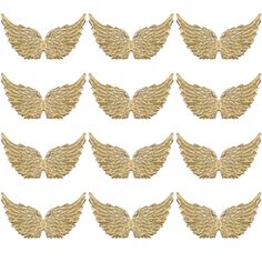 a set of twelve gold angel wings on a white background