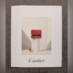 an advertisement for cartier featuring a red chair