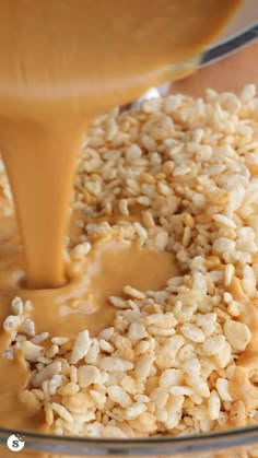 a glass bowl filled with oatmeal and caramel being poured into it