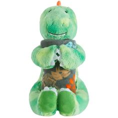 a green stuffed dinosaur sitting on top of a white background