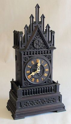 an ornate clock with roman numerals on the face is shown in front of a white background