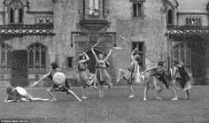 several children are playing in front of an old building