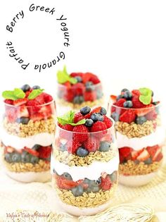 three glasses filled with fruit and granola on top of a table