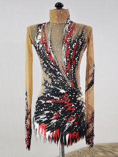 a mannequin is dressed in an elaborate dress with sequins and beads