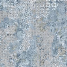 an old, grungy wallpaper with white and grey designs on it's surface