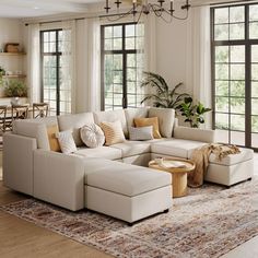 a living room filled with furniture and lots of windows