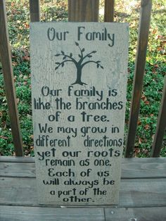 a wooden sign that says our family is like the branches of a tree