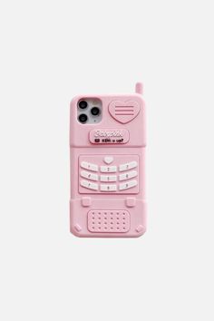 a pink cell phone case sitting on top of a white surface