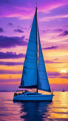 a sailboat is sailing in the ocean at sunset with purple and pink clouds behind it