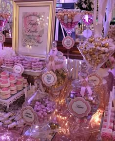 a table topped with lots of desserts and candies