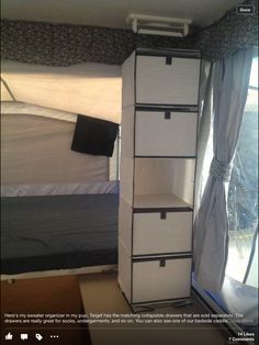 a room with a bed and some drawers in it