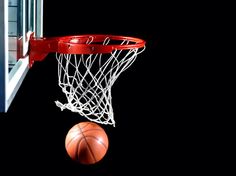 a basketball is going through the net with it's end in the air,