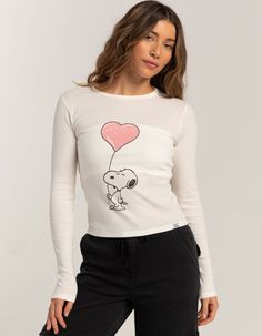 Rsq X Peanuts Love Collection Womens Snoopy Heart Long Sleeve Baby Tee. Large Graphic Screened On Front. Ribbed Crew Neckline. Long Sleeve. Fitted Silhouette. 50% Cotton, 50% Polyester. Machine Wash. Imported. Model Is Wearing A Size Medium. Model Measurements:height: 5'7" Bust: 34.5"waist: 27"hips: 38" | Rsq X Peanuts Love Collection Snoopy Heart Long Sleeve Baby Tee Cute Tops With Heart Graphic For Spring, Playful White Tops With Heart Graphic, Playful White Heart Print Tops, Fitted Long Sleeve Top With Cartoon Print, Cute Fitted Top With Character Print, Playful Fitted Tops With Character Print, Fitted Playful Tops With Character Print, Playful Cotton Tops With Heart Print, Cute Long Sleeve Tops With Heart Graphic