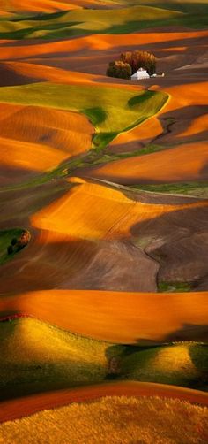 an aerial view of the rolling hills and fields