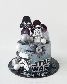 a star wars themed birthday cake with decorations